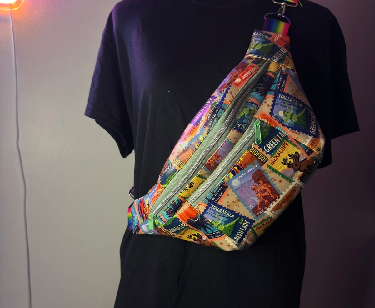 Handmade cryptid fanny pack with Bigfoot, Mothman, and Nessie postage-stamp print