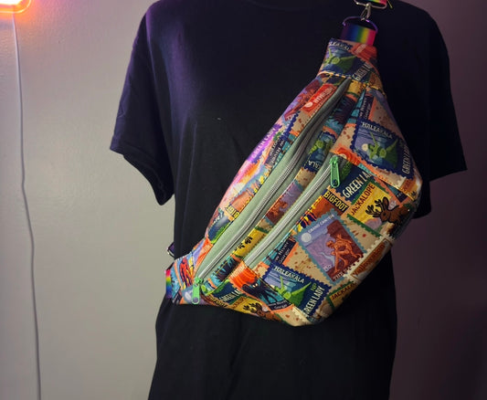 Handmade cryptid fanny pack with Bigfoot, Mothman, and Nessie postage-stamp print