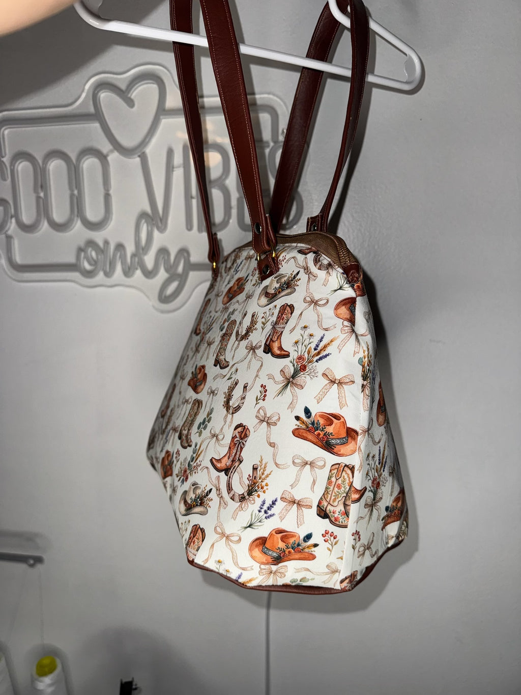 Cowgirl western top-handle handbag with cowboy boots and floral hat print