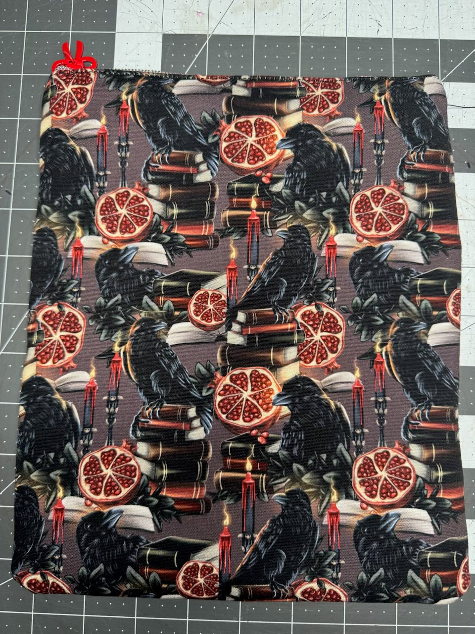 Handmade zippered book sleeve pouch in dark academia raven and pomegranate print, 8x9.5 inches