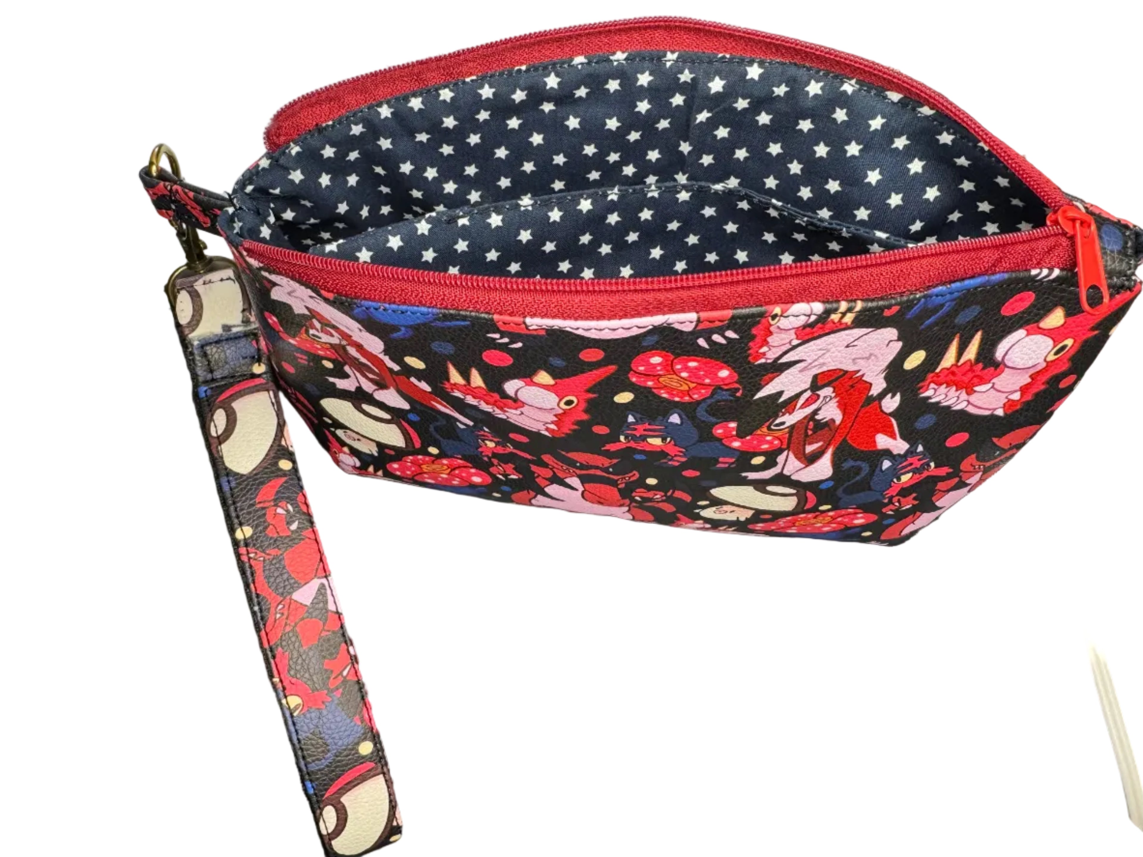 Floral-patterned pouch with a strap on a dark surface