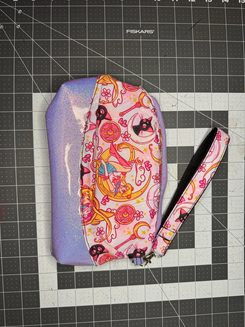 Colorful fabric pouch with a pattern on a grid background
