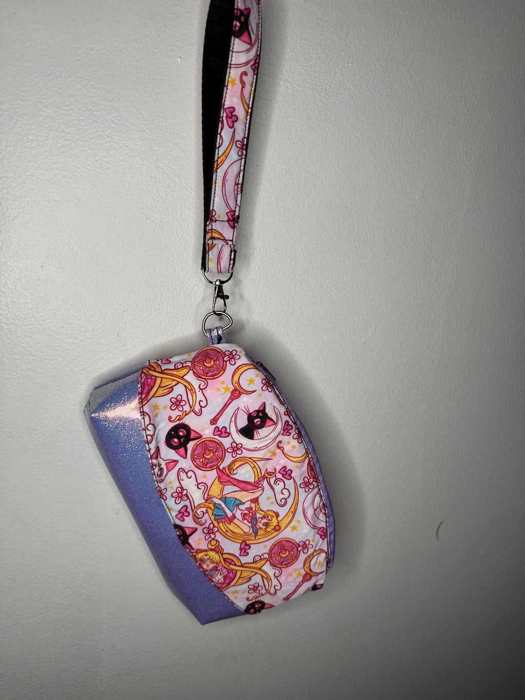 Colorful fabric keychain with cartoon design on a plain background