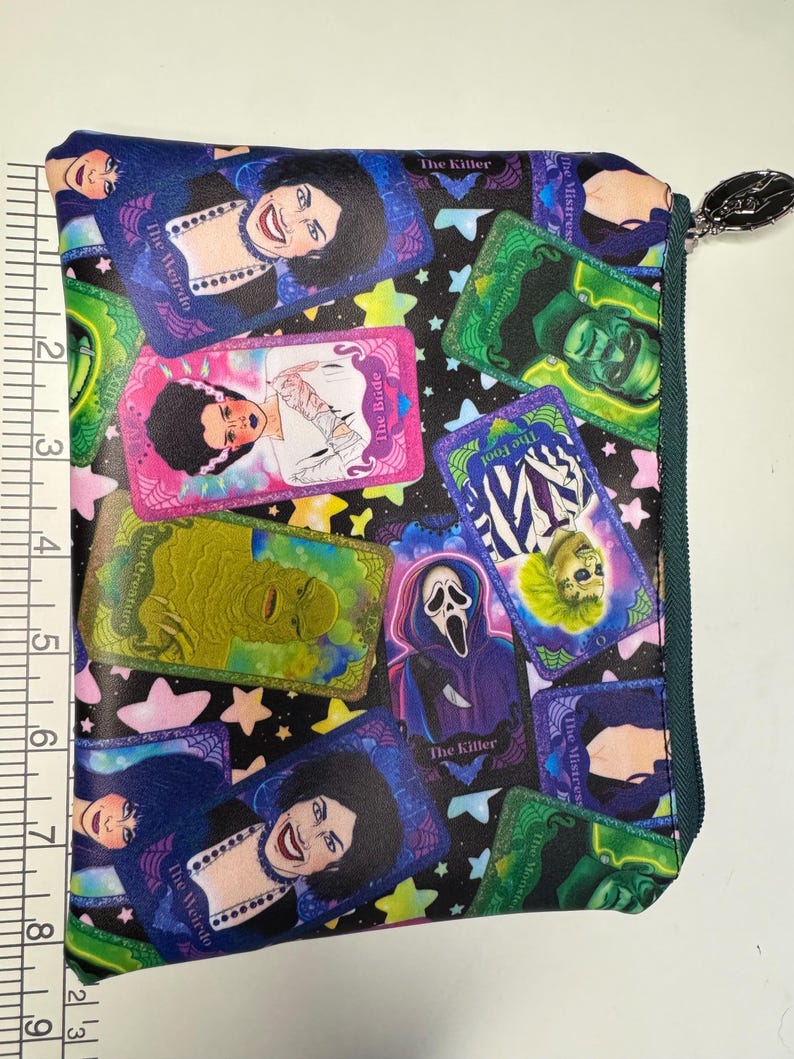 Horror tarot zipper pouch measured against a ruler