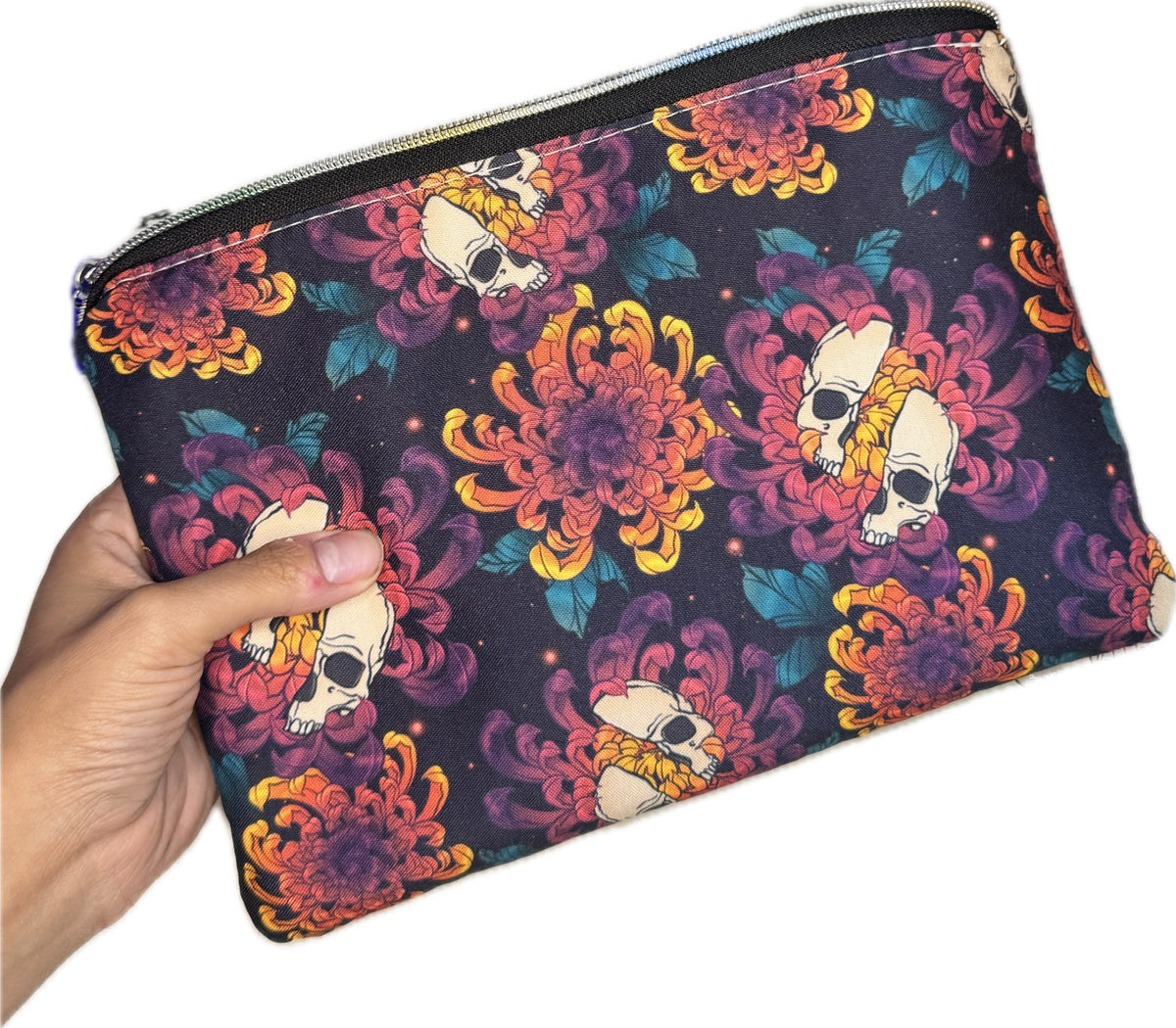 Skull and chrysanthemum zipper pouch held in hand